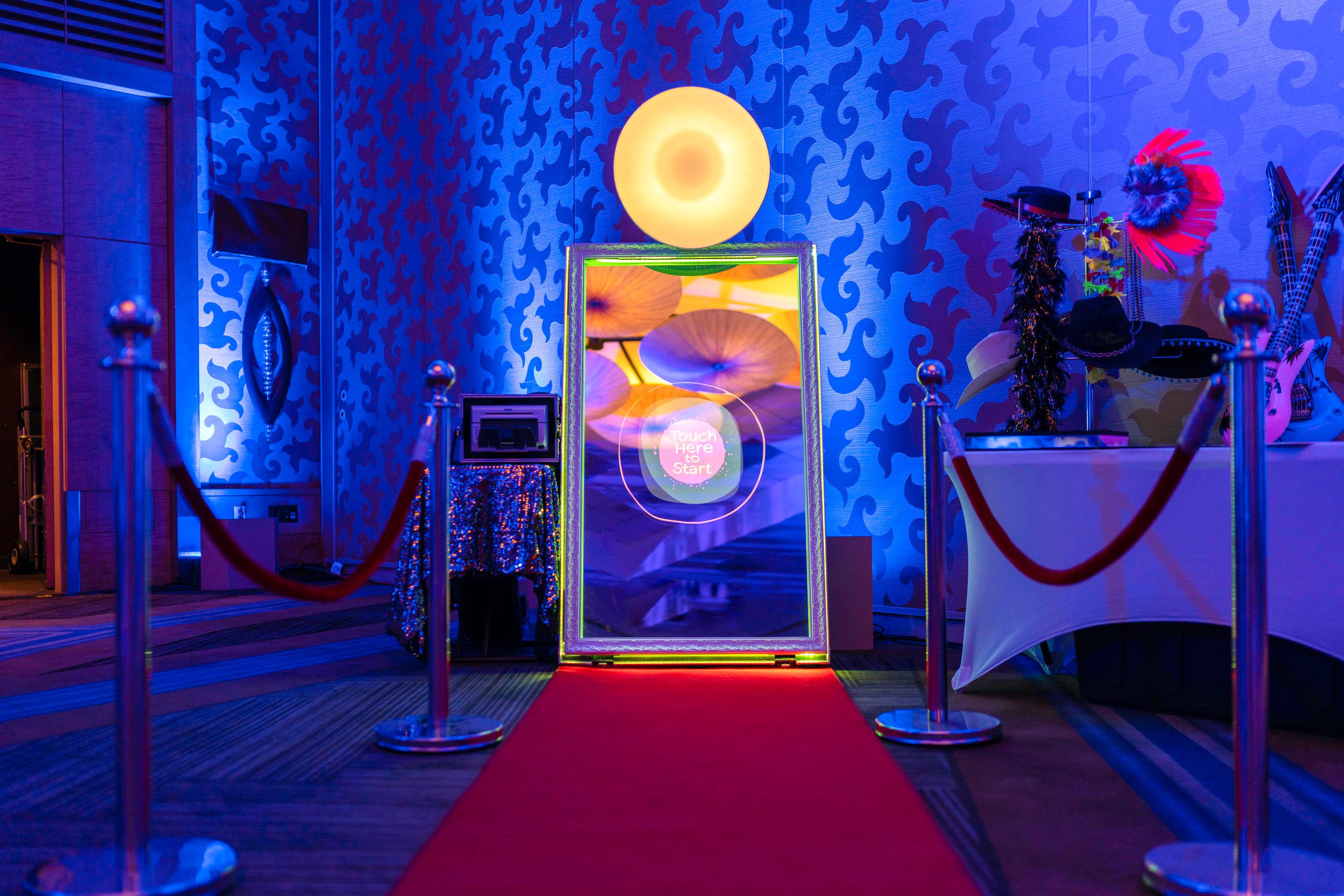 Capture the Magic with our VIP Gold Stanchions and Red Velvet Ropes Magic Mirror Photo Booth